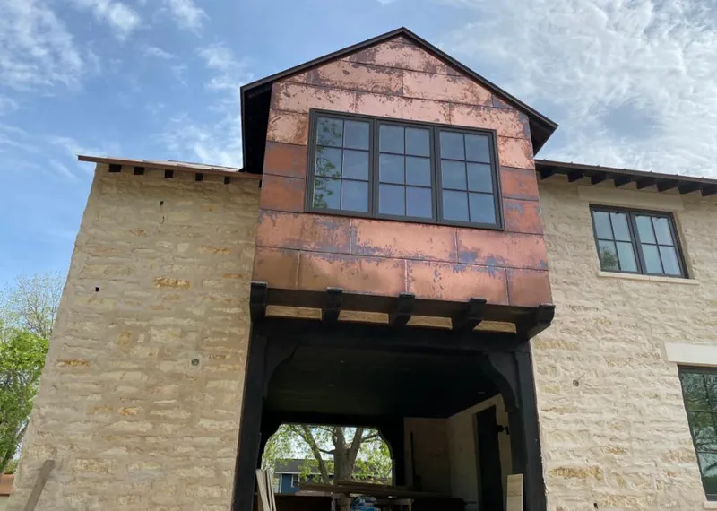 Copper metal panel facade on a stone building for Skylight Installation in Yucca Valley